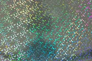 Colorful rainbow holographic dots on dark, silver and grey background; magic color light effect