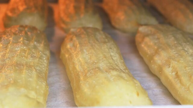 Increased shooting speed for baking custard French eclairs in the oven. Accelerated video. 4k