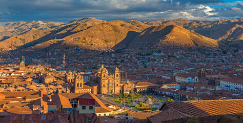 Cusco city panorama at sunset with Plaza de Armas main square, Cathedral and churches, Peru.