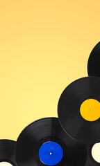 Multi colored vinyl records on a background. Retro or music concept