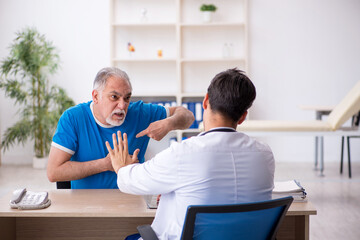 Old male patient visiting young male doctor