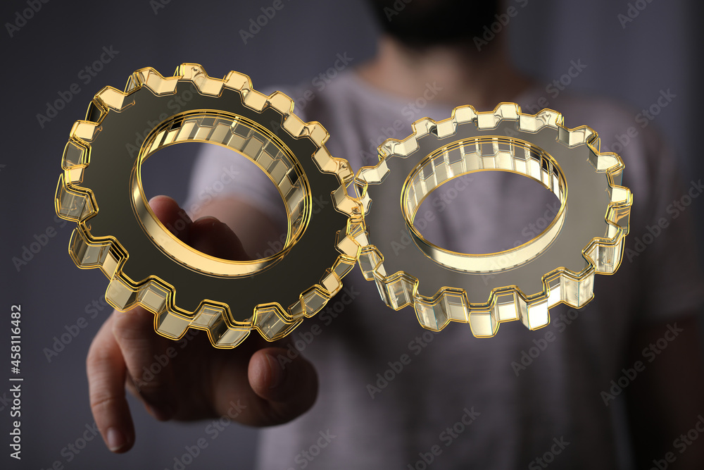 Aufkleber Man draws gears on virtual screen. Blurred Abstract engine room..