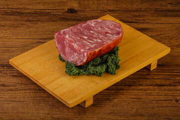 Beef ham piece over board