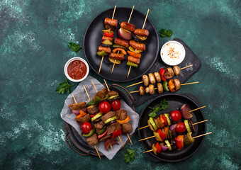 Grilled kebabs with meat, mushrooms and vegetables