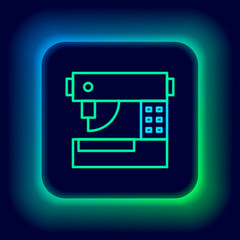 Glowing neon line Sewing machine icon isolated on black background. Colorful outline concept. Vector
