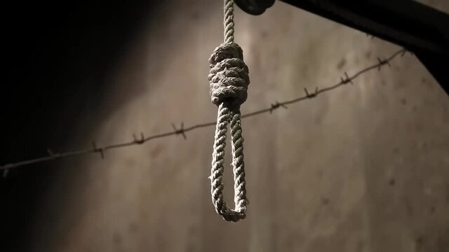 hanging gibbet and barbed wire in concentration camp