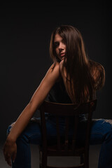 Posing while sitting on the small chair