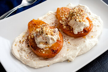 Roasted Pears with Espresso Mascarpone Cream: Roasted pears topped with vanilla espresso cream, cocoa, and ground almonds