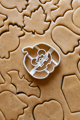 cookie cutter pumpkin halloween cookie dough and gingerbread vertical photo 