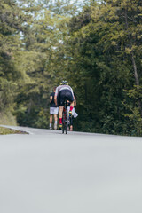 Fototapeta premium Athletic couple running on a street next to each other. Nature,fit and healthy concept.