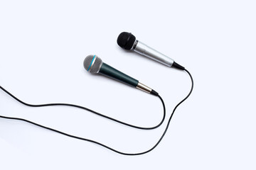 Two microphones on white background.