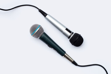 Two microphones on white background.