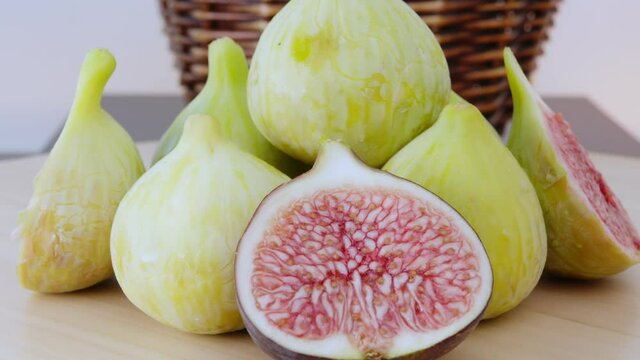 Green Figs Rotating. This video captures a few of figs  rotating and full of basket behind the scene.