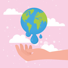 world with drops over hand