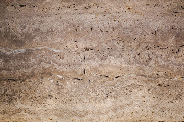 the texture of a stone wall with cracks