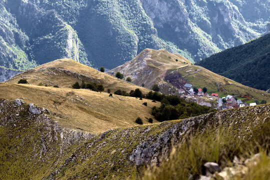 High Angle Shot Of Mountainous Landscape With Layers Of Peaks Under Sunlight