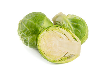 Fresh green Brussels sprouts on a white background. Brussels sprouts cut in half casts a shadow on white isolate