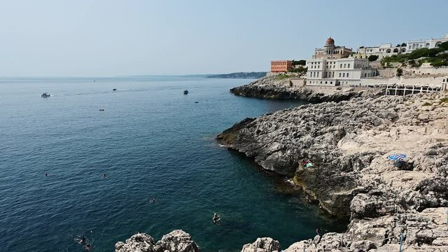 Static footage on the sea landscape of Santa Cesarea Terme, Puglia, Italy. August 2021. On a magnificent summer day, the Ottoman-style villa sticchi stands out on the profile of the coast.