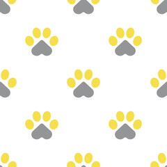 Paws of a cat, dog or puppy on a white background. Seamless cute pattern for fabrics, decorative pillows. For pet shops and veterinary clinics. The trend colors of 2021 are yellow and gray. 