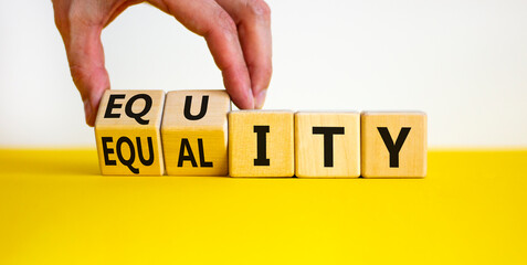 Equity and equality symbol. Businessman turns wooden cubes and changes the word 'equality' to 'equity'. Beautiful white background. Business, equity and equality concept. Copy space.