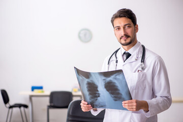 Young male doctor radiologist sitting in the clinic