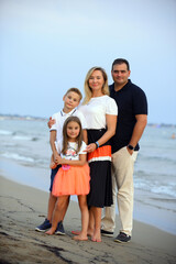 Fototapeta premium Portrait of a family at the beach
