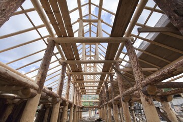 Fototapeta premium wooden house frame against blue sky