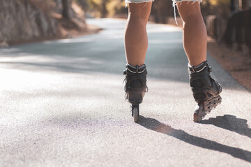 a young gay man skating on in-line skates.
