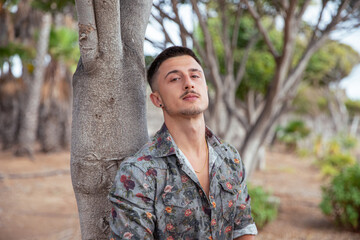 Portrait of a serious and concentrated young slavic boy. Pensive man with Eastern European features
