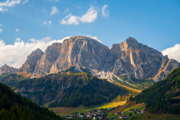 Fototapeta premium Corvara in Badia charming small Italian mountain village in the valley in the background Sassongher beautiful mountain, Province of Bolzano, Val Gardena, South Tyrol