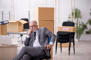 Old male employee in relocation concept