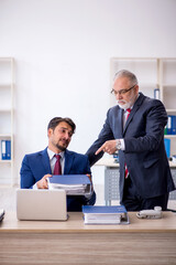 Two male colleagues working in the office