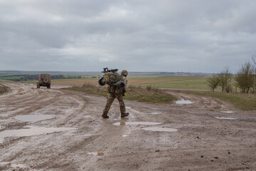 British army soldier completing an 8 mile tab tabbing exercise with fully loaded 25Kg bergen