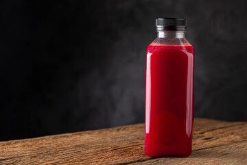 Red beet juice in plastic bottle.