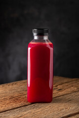 Red beet juice in plastic bottle.