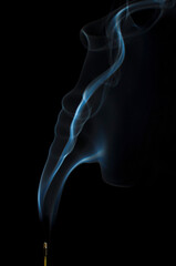 Incense smoke against dark background