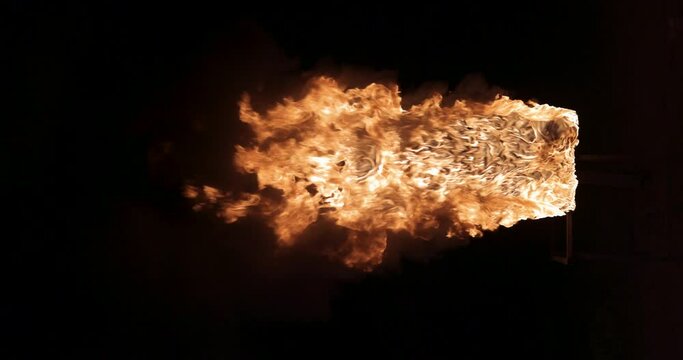 In this video, we see how a strong fire broke out on a rectangular surface resembling a door or window.