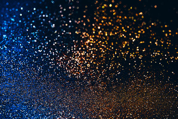 Fototapeta na wymiar Sparkling glitter golden and blue Christmas background