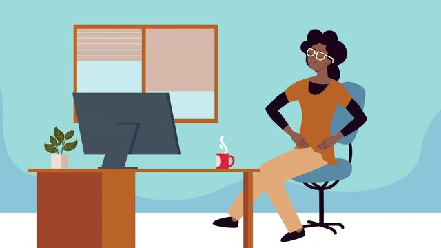 afro woman taking an active break seated in the office