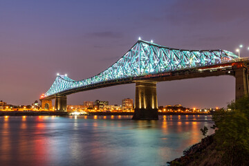 Fototapeta na wymiar Jacques Cartier Bridge Illuminated at night. Montreal, Quebec, Canada.