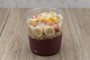 Acai fruit bowl pitaya, strawberry, and coconut with blended flavors to increase your immunity and...