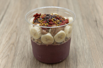 Acai fruit bowl cacao, goji berry, and bee pollen with blended flavors to increase your immunity and better nutrition