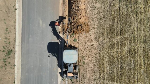 Overhead View Of Backhoe Digging