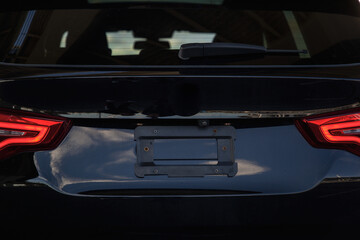 View of the trunk and taillights of the crossover in dark color
