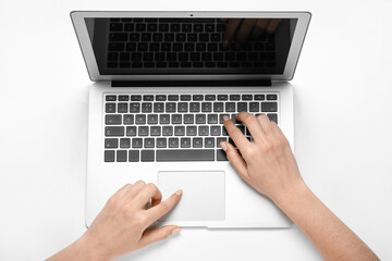 Fototapeta na wymiar Woman working with laptop on white background