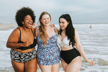 Cheerful plus size women enjoying the beach - Powered by Adobe