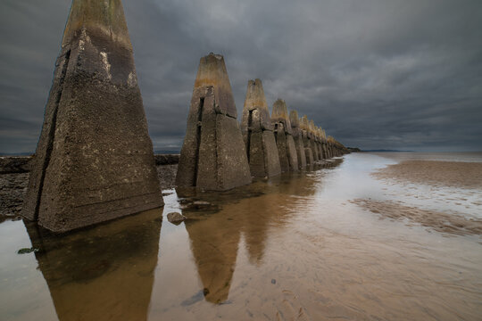 Cramond Causeway Near Edinburgh Leading to Cramond Island, this can be crossed at low tide.Signs at the start give safe crossing times.Were constructed as an anti-boat boom during the II World War 