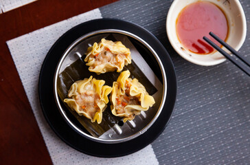 Steamed open dumplings Shumai with meat filling from pork with onion, carrot and mushrooms....