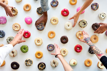Diversity People Hands Reach for Doughnuts