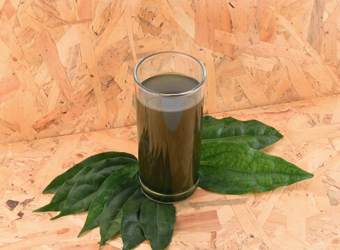 herbal yanang leaf juice and yanang leaves on wooden background